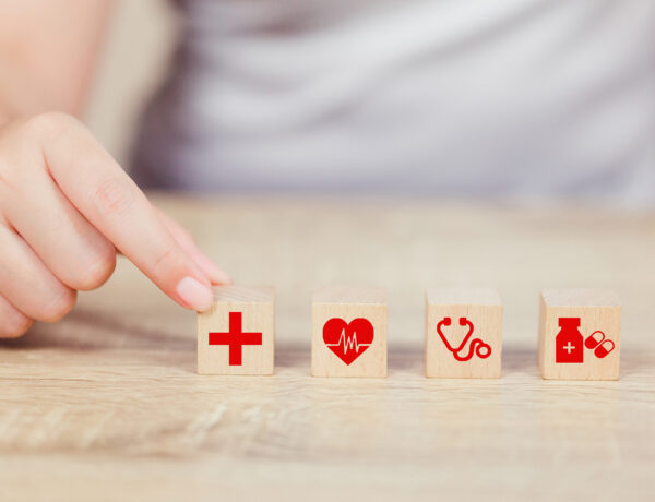 Health Insurance Concept,hand arranging wood block stacking with Health Insurance Concept,hand arranging wood block stacking with icon healthcare medical.